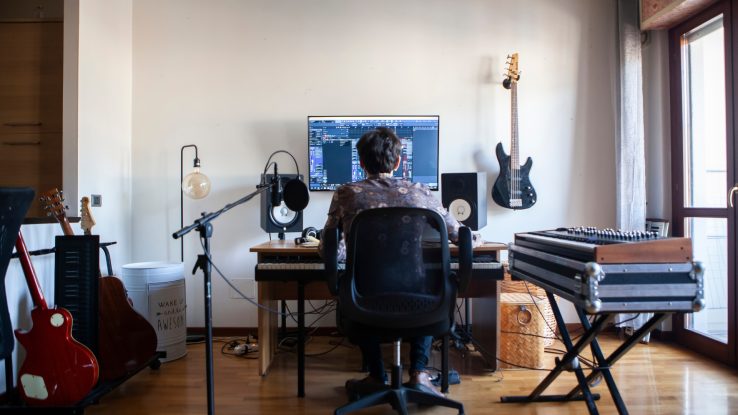 Producer Composing Music in Home Studio